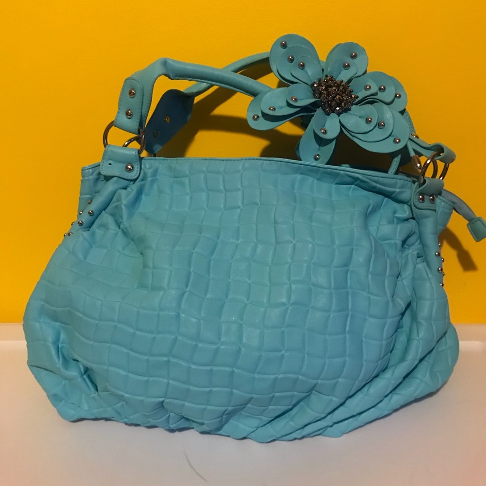 Large blue purse with flower